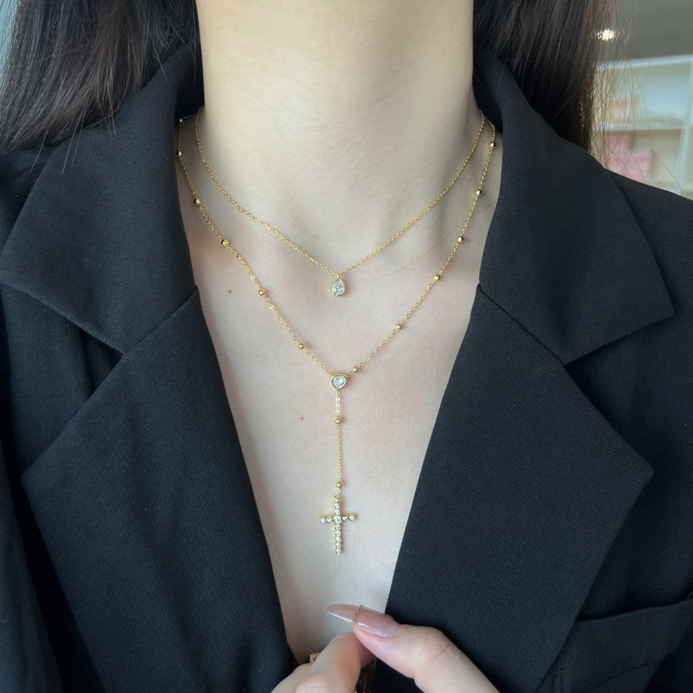 Collana due fili con croce, cuore e goccia